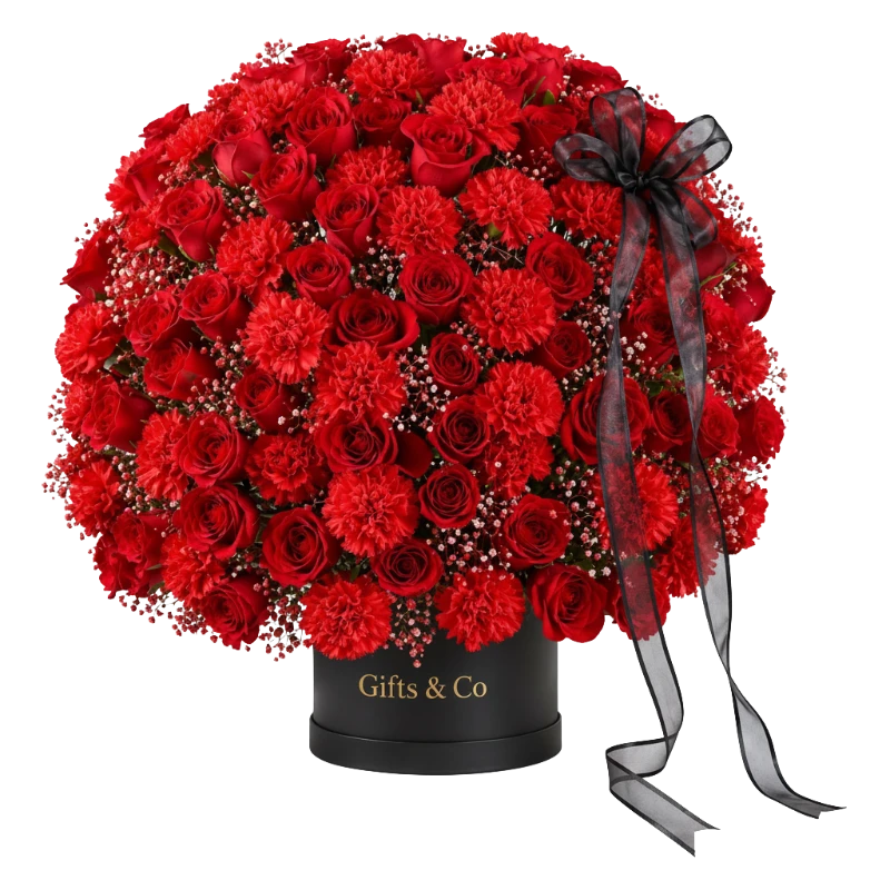 Luxury Red Rose Box handcrafted with premium fresh red roses, carnations, and baby's breath in a signature black Gifts & Co flower box with an elegant satin ribbon.