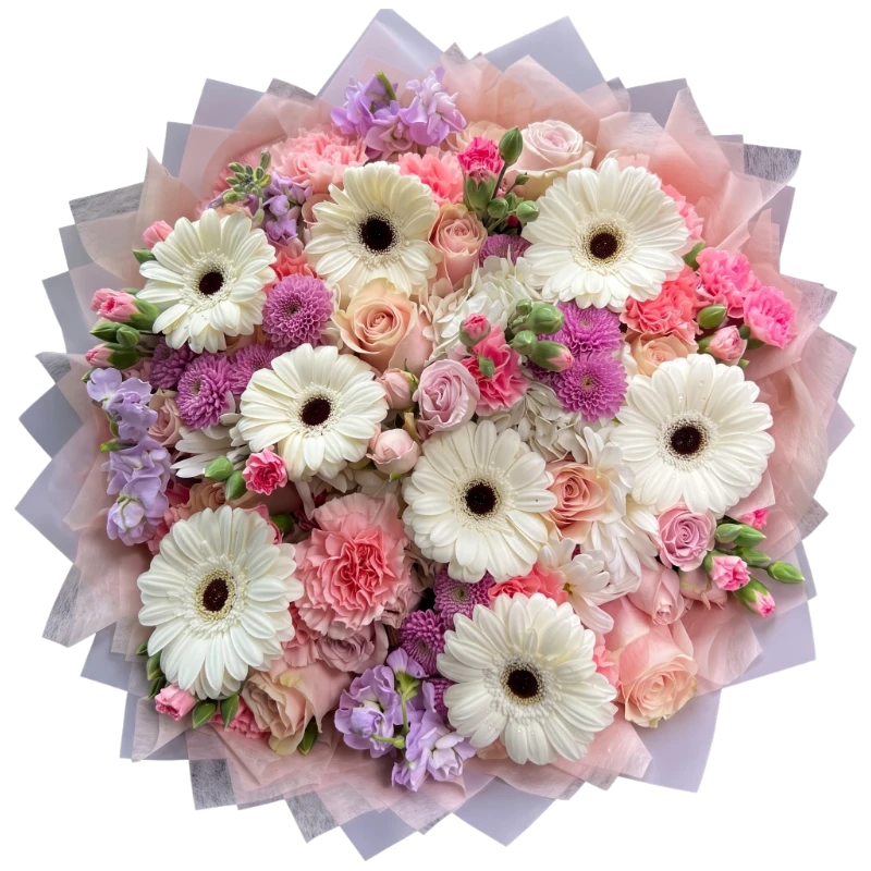 Luxury Pastel Mixed Flower Bouquet featuring premium white gerberas, roses, carnations, chrysanthemums, stock flowers and seasonal blooms wrapped in elegant blush floral wrapping by Gifts & Co.