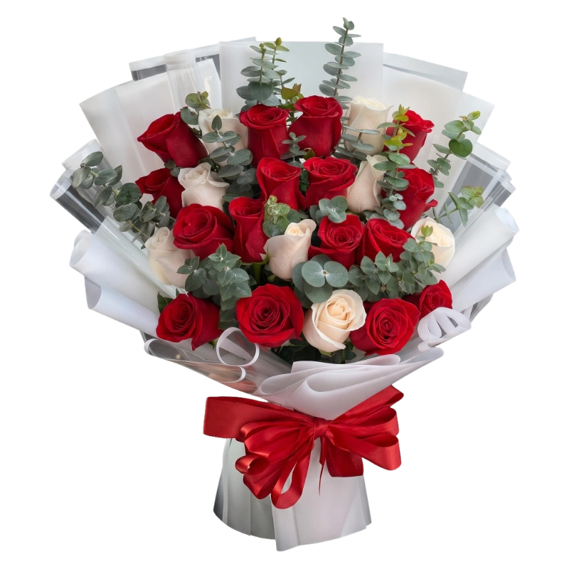 Crimson Harmony Bouquet featuring premium crimson red roses, elegant ivory roses, fresh silver dollar eucalyptus, luxury white floral wrapping, and a red satin ribbon handcrafted by Gifts & Co.