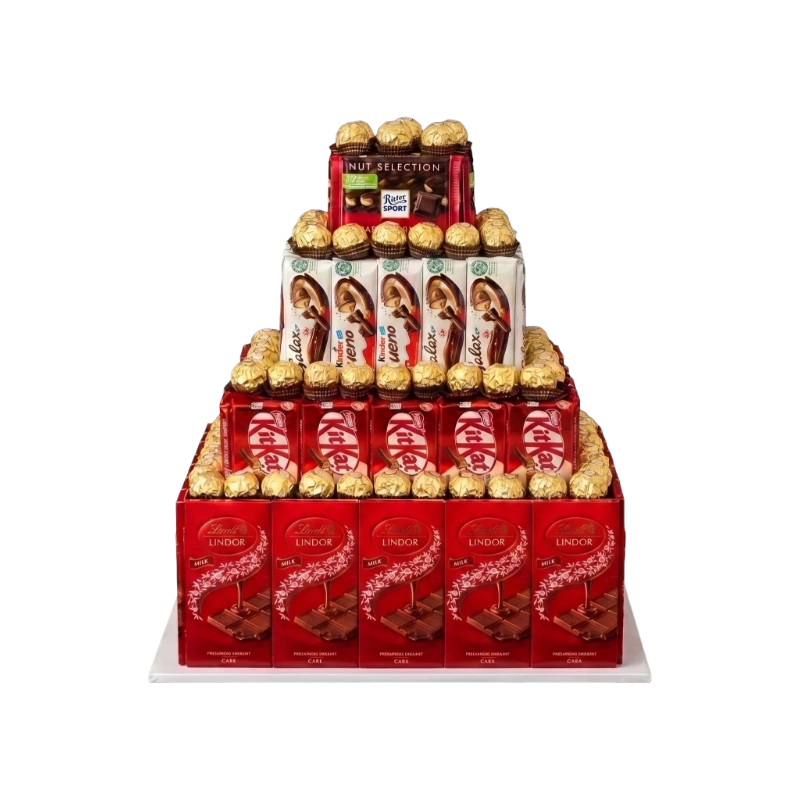 The Grand Chocolate Tower featuring Ferrero Rocher, Lindt, Kinder Bueno, KitKat, Ritter Sport, and premium chocolates handcrafted into a luxury tiered gift by Gifts & Co.