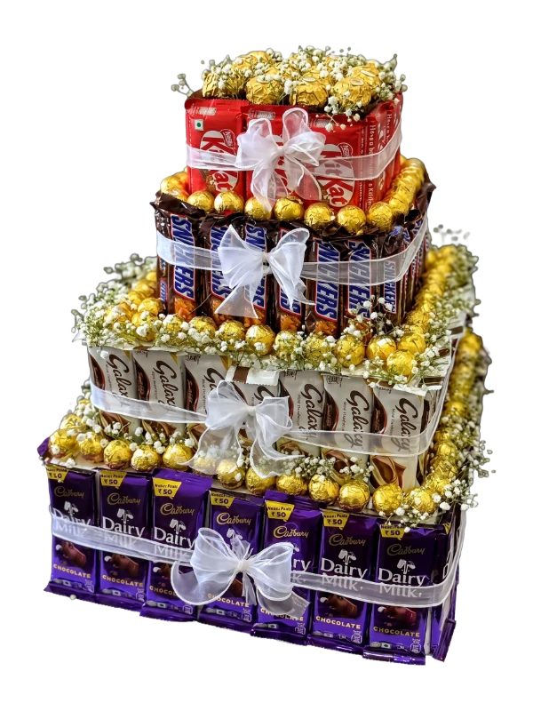Golden Celebration Chocolate Tower featuring Ferrero Rocher, Cadbury Dairy Milk, Galaxy, KitKat, Snickers, baby's breath, and satin ribbons handcrafted into a luxury multi-tier gift by Gifts & Co.
