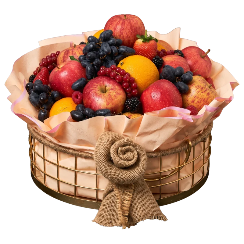 The Rustic Orchard Fruit Basket featuring premium apples, grapes, oranges, strawberries, berries, and seasonal fruit beautifully arranged in a reusable gold wire basket by Gifts & Co.