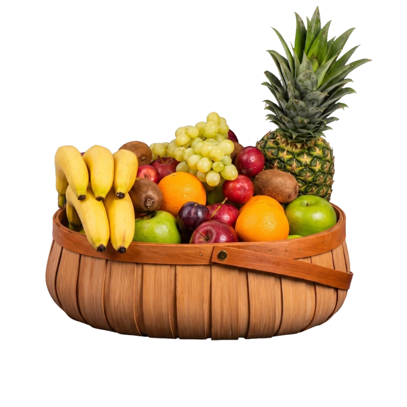 The Country Harvest Fruit Basket featuring fresh pineapple, grapes, apples, bananas, oranges, kiwi fruit, and seasonal fruit arranged in a reusable woven wooden basket by Gifts & Co.