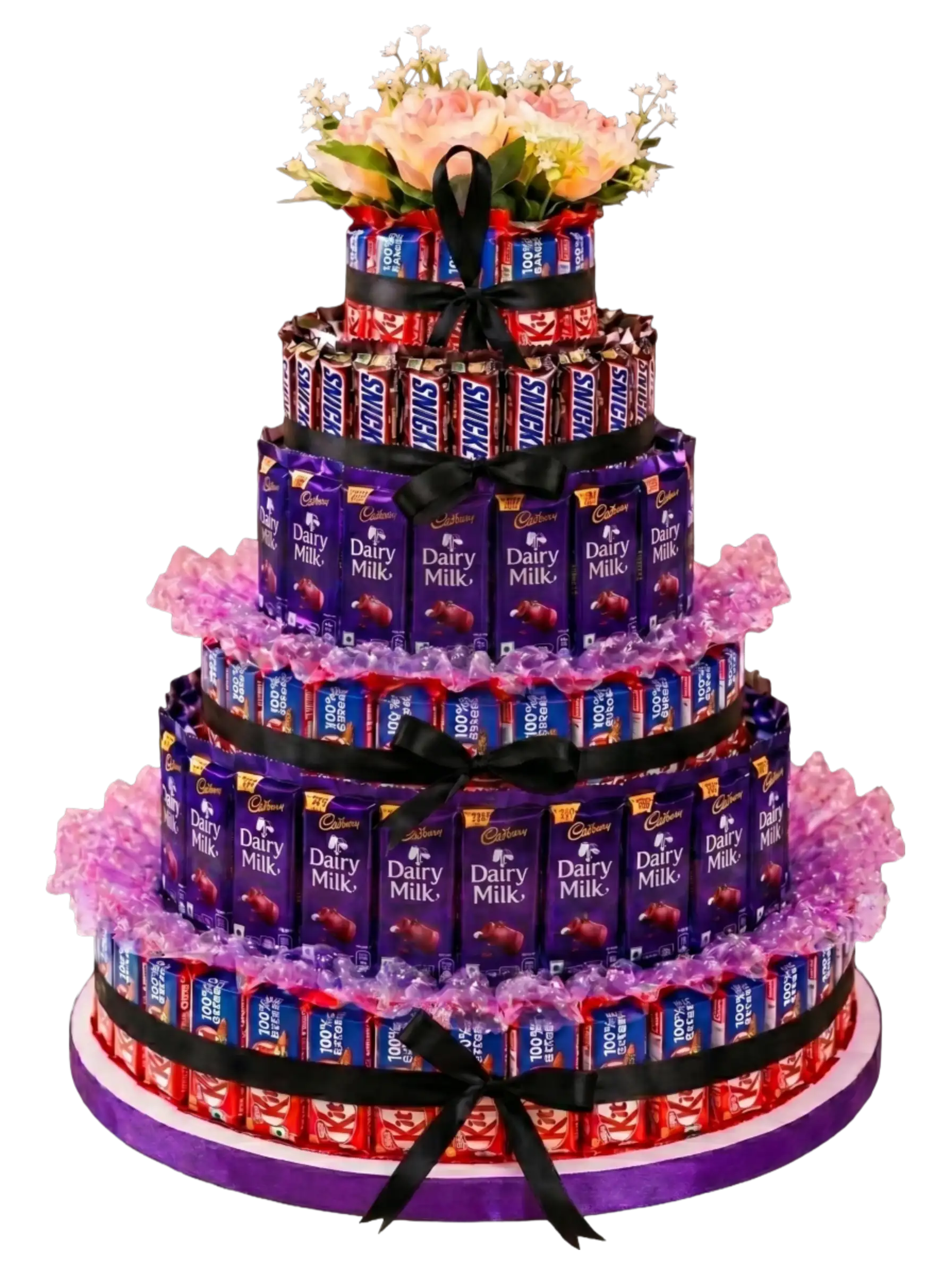 Royal Celebration Chocolate Tower featuring Cadbury Dairy Milk, KitKat, Snickers, premium chocolates, decorative florals, and elegant multi-tier presentation by Gifts & Co.