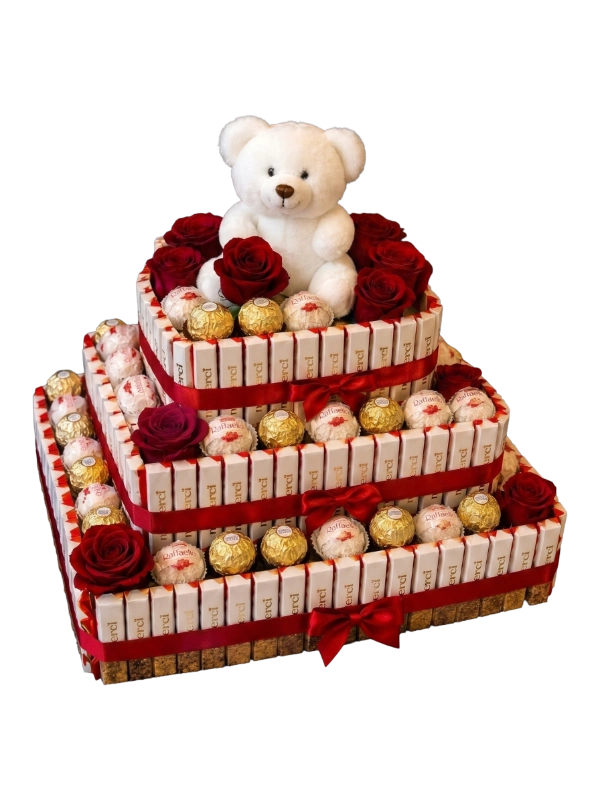 The Cuddly Romance Chocolate Tower featuring a plush teddy bear, Ferrero Rocher chocolates, Raffaello chocolates, premium chocolate bars, and decorative red roses handcrafted by Gifts & Co.