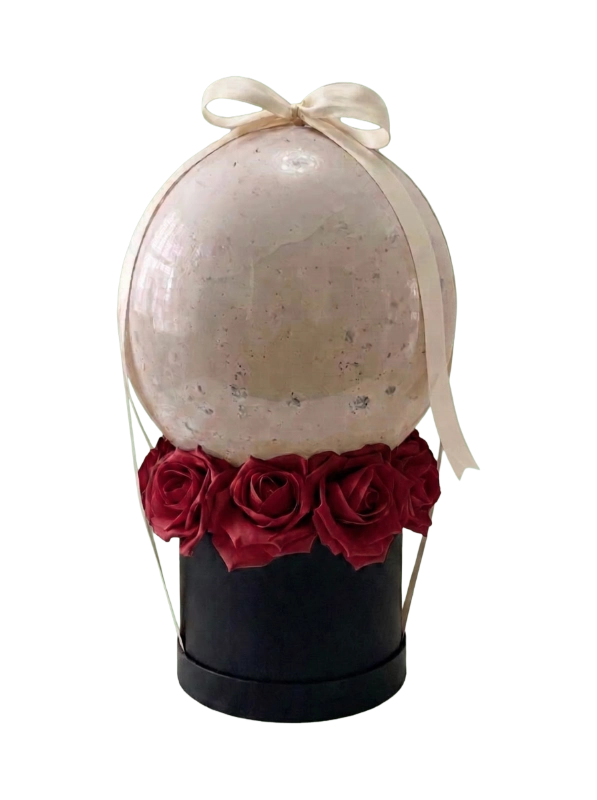 The Pearl Elegance Rose Balloon Box featuring premium red roses beneath a pearl confetti bubble balloon with an ivory satin bow presented in a luxury black hat box by Gifts & Co.