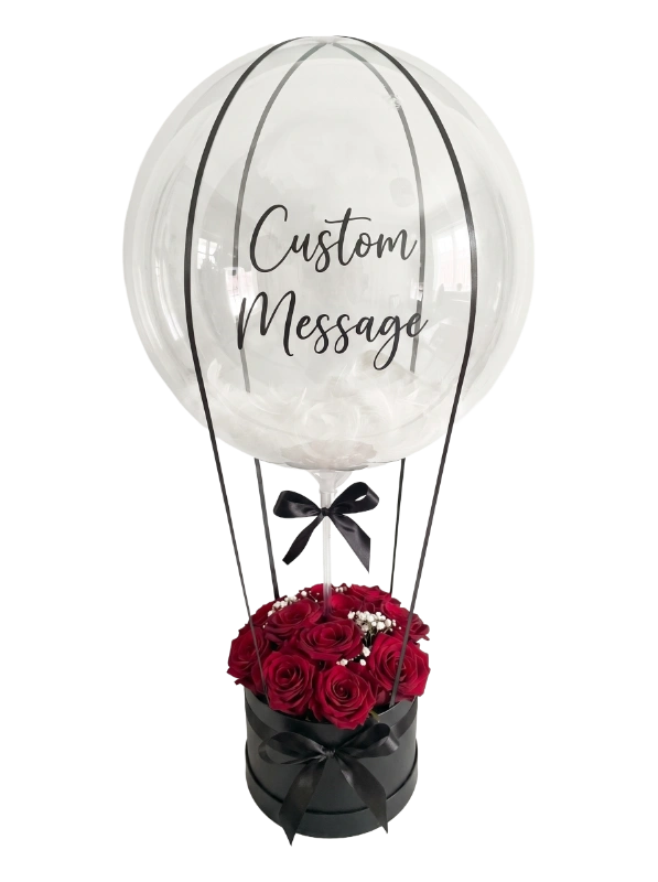 The Luxury Balloon Rose Box featuring a personalised oversized bubble balloon with premium fresh red roses arranged in a luxury black keepsake hat box by Gifts & Co.