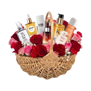 Sample customisable Hair Care Gift Hamper for Her featuring premium hair oils, treatments and styling products arranged with pink and red flowers in a luxury Gifts & Co basket.