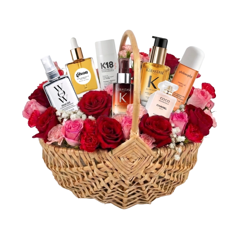 Sample customisable Hair Care Gift Hamper for Her featuring premium hair oils, treatments and styling products arranged with pink and red flowers in a luxury Gifts & Co basket.